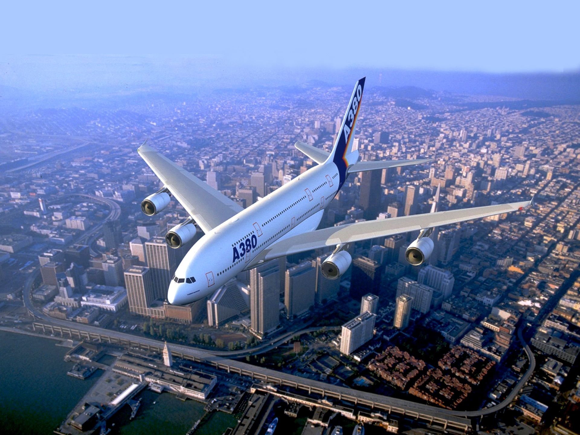 Самолет над городом обои фото